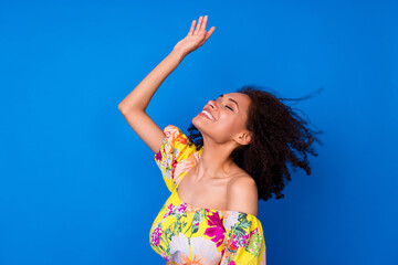 Canvas Print - Photo of pretty dreamy girl dressed off shoulders blouse smiling enjoying wind blowing isolated blue color background