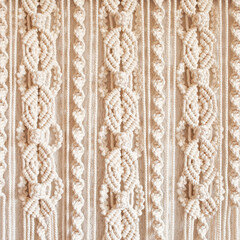 Wall Mural - Handmade macrame. Macrame braiding and cotton threads.  Female hobby.  ECO friendly modern knitting DIY natural decoration concept in the interior.  100% cotton wall decoration.
