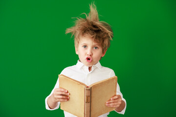 Poster - Surprised child against green chalkboard in class