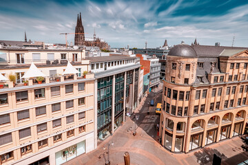 Wall Mural - Aerial cityscape view of a popular shopping streets and Cologne Cathedral in the background. Travel sightseeing and real estate