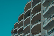Interesting Arhitectural Round Elements Of Building Or Hotel. Multiple Balconies Forming An Interesting View.