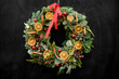 awesome beautiful wreath decorated with dry orange slices balls and ribbon