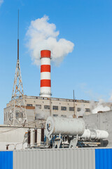 Wall Mural - The pipe of the industrial plant emits toxic smoke into the atmosphere and air. Pollution of the environment and ecology. Thermal power plant power lines voltage