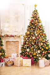 Wall Mural - A large beautiful traditional Christmas tree with gifts in a classic interior.