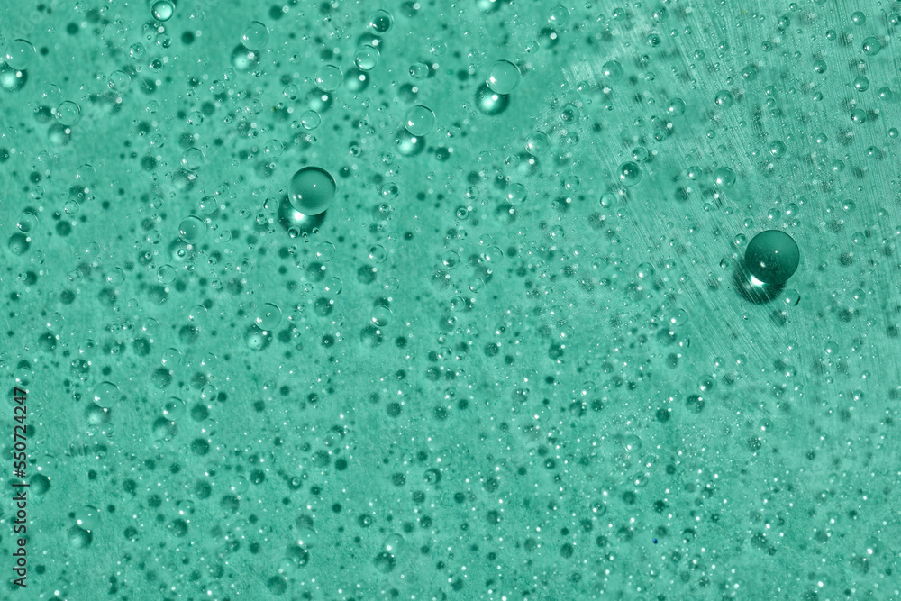 Water drops on mint background