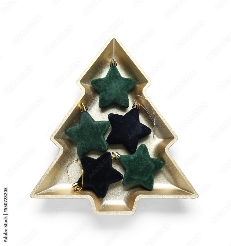 Plate in shape of Christmas tree with decorations on white background