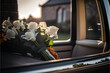 Funeral flowers white roses and lilies inside a hearse at a funeral on a beautiful yet sad day