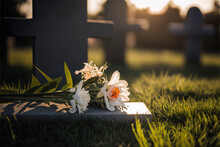Funeral Flowers White Roses And Lilies Lie On The Green Pasture Of A Cemetery On A Beautiful Day During Golden Hour