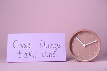 Wall Mural - Card with phrase Good Things Take Time and clock on pink background. Motivational quote