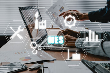 MES - Manufacturing Execution System concept, Business adviser meeting to analyze and discuss the situation on the financial report with mes icon on virtual screen.