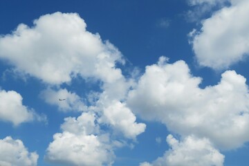 Wall Mural - beautiful fluffy clouds in blue sky, natural background