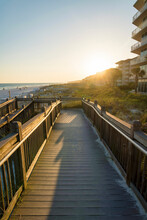 Sloped Wooden Boardwalk During Sunset At The Beach In Destin, Florida