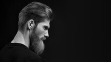 Dramatic Concept Portrait Of A Young Handsome Bearded Man Looking Ahead. Perfect Beard.