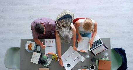 Wall Mural - Top view of business people, marketing team and branding management planning logo, creative strategy and ideas in startup company. Designers, advertising meeting and teamwork collaboration at table