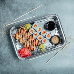 Wall Mural - Top view of sushi set with sticks