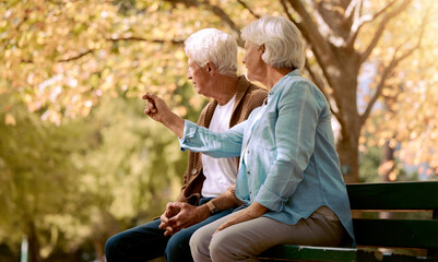 Canvas Print - Park love, communication and senior couple in nature to relax, retirement peace and outdoor conversation. Summer care, content and talking elderly man and woman on a bench in Portugal in spring