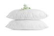 © New Africa - Soft pillows with beautiful flowers on white background
