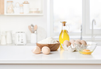 Baking cooking ingredients on kitchen table interior with copy space