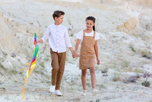 Friendly Brother And Sister Go To Launch Kite Holding Hands.