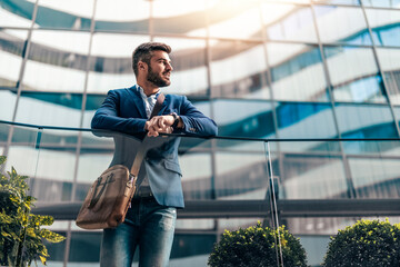 Portrait of smiling businessman outdoors