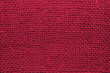 Top view of sackcloth fabric for background. Close up of viva magenta color sackcloth texture for background.