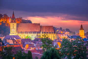 Fototapete - Brasov, Romania - Colored sunset with scenic city in Transylvania.