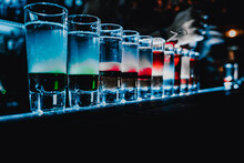 Bartender Making Collection Of Colorful Shots. Set Of Cocktails At The Bar
