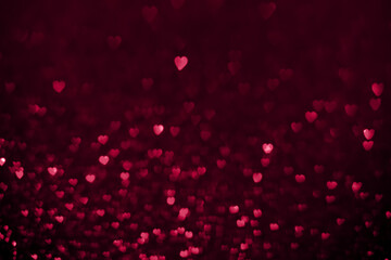 Trendy viva magenta color of the year 2023, pink red hearts, sparkling glitter bokeh background, valentines day abstract defocused texture
