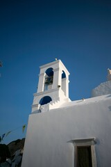 Canvas Print - Vertical shot of the bell tower of Anastasi church with blue sky in the background, Greece