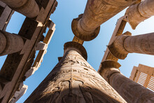Ancient Ornamental Columns In Old Temple Against Blue Sky