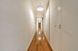 © ADDICTIVE STOCK - Empty corridor of the interior of a modern apartment
