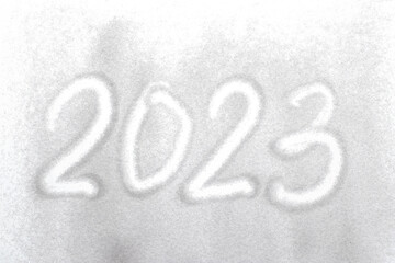 2023 writing on the white sand on white