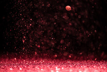 Color Of 2023 Year Viva Magenta. Pink Sequins Fall On A Black Background