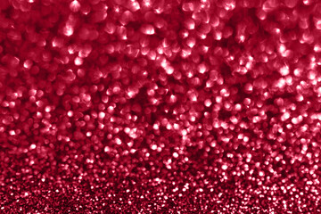 Wall Mural - Glamour red sparkling background. Blured glitter background with blinking stars. Holiday abstract texture. Demonstrating Viva Magenta - trendy color of the year 2023