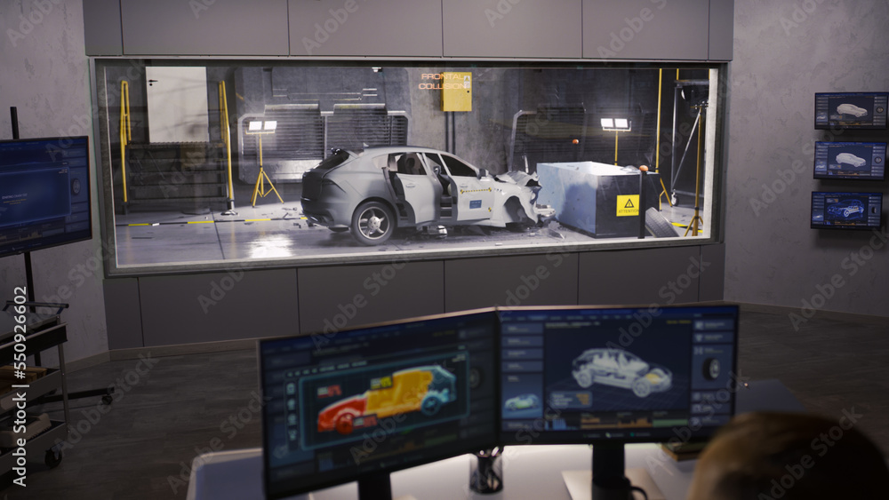 Car Crash Testing Machine An engineer in a crash test lab uses a car crash test system to ...