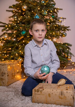 A Boy With Autism New Year Near The Christmas Tree