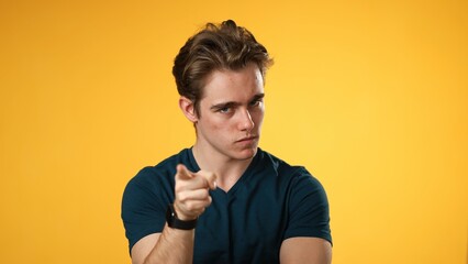 Portrait of angry frustrated despair upset portrait of young man 20s isolated isolated on yellow background.