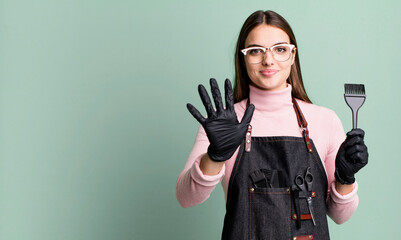 Wall Mural - young pretty woman smiling and looking friendly, showing number five. hair dryer concept