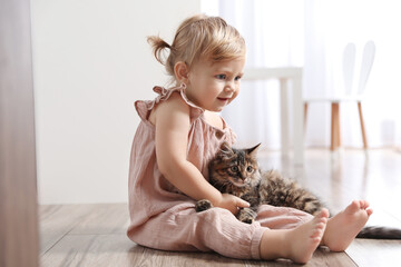 Sticker - Cute little child with adorable pet on floor at home