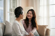 © imtmphoto - asian adult daughter and senior mother enjoying conversation at home