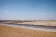 The panorama of a road on desert area near the famous Giza pyramids, Egypt.