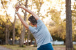 © Anela/peopleimages.com - Fitness, park and stretching with a senior woman doing a warm up outdoor for exercise or a workout. Nature, health and training with a mature female back outside in a garden for a healthy lifestyle