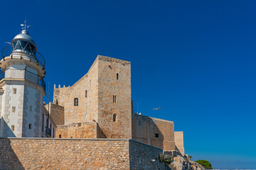 Canvas Print - Castle of Peniscola with the lighthouse in the costa del azahar in Castellon, valencian community in Spain
