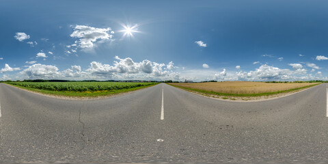 Wall Mural - full seamless spherical hdri 360 panorama view on no traffic asphalt road among fields with overcast sky and white clouds in equirectangular projection,can be used as replacement for sky in panoramas