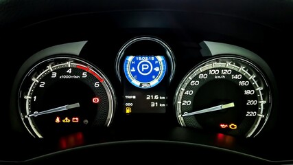 Car dashboard have a Speed meter, Tachometer, Temperature meter, Fuel indicator, Trip mile meter, Seat-belt warning light, Turn signal indicator, Door open warning light, Battery warning light.