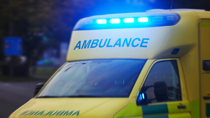 Wall Mural - Ambulance car of emergency medical service in blurred motion. Themes rescue, urgency and health care..