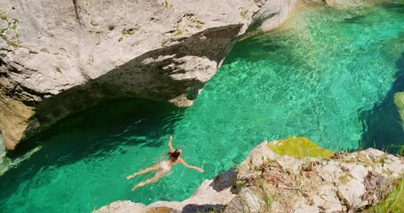 Wall Mural - Island, woman swimming and tropical view for travel, freedom adventure and summer holiday vacation. Swim, outdoor lifestyle and person in bikini, relax swimmer and sport workout exercise in Tuscany