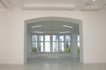 Canvas Print - Empty office room with white walls, clean windows and modern lights on ceiling. Interior design