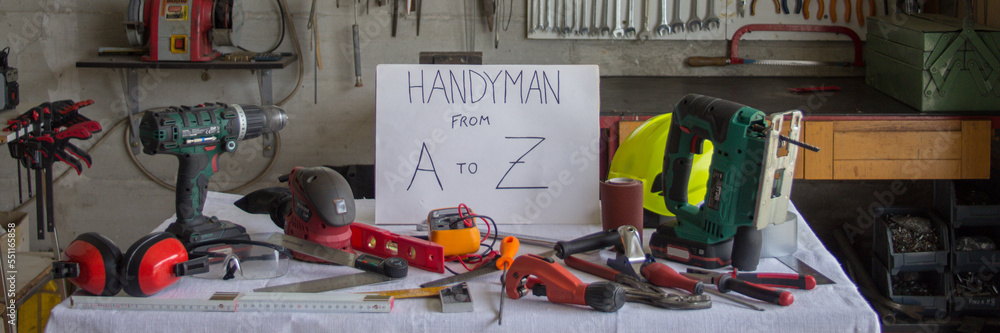 Image of a workshop with a workbench with work tools and a Handyman ...