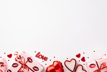 Valentine's Day Concept. Top View Photo Of Gift Boxes In Wrapping Paper With Kiss Lips Pattern Heart Shaped Balloon Candles Inscription Love And Confetti On Isolated White Background With Blank Space